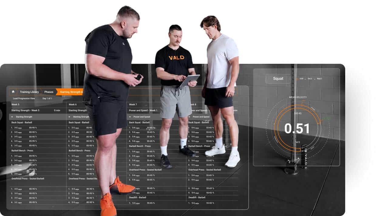 Practitioner showing athletes their training prescriptions based on velocity zones to support autoregulated loading decisions.
